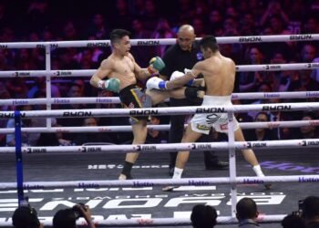Fighters compete inside the ring at BYON Combat Showbiz 3 at Tennis Indoor Senayan in Jakarta.