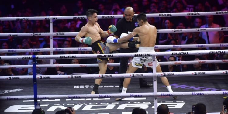 Fighters compete inside the ring at BYON Combat Showbiz 3 at Tennis Indoor Senayan in Jakarta.