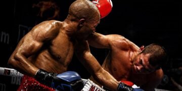 Chris John fights Simpiwe Vetyeka during their 2013 featherweight title bout in Perth.