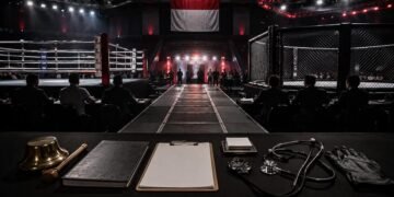 Officials supervise a combat sports event under Indonesia's fight sanctioning system.